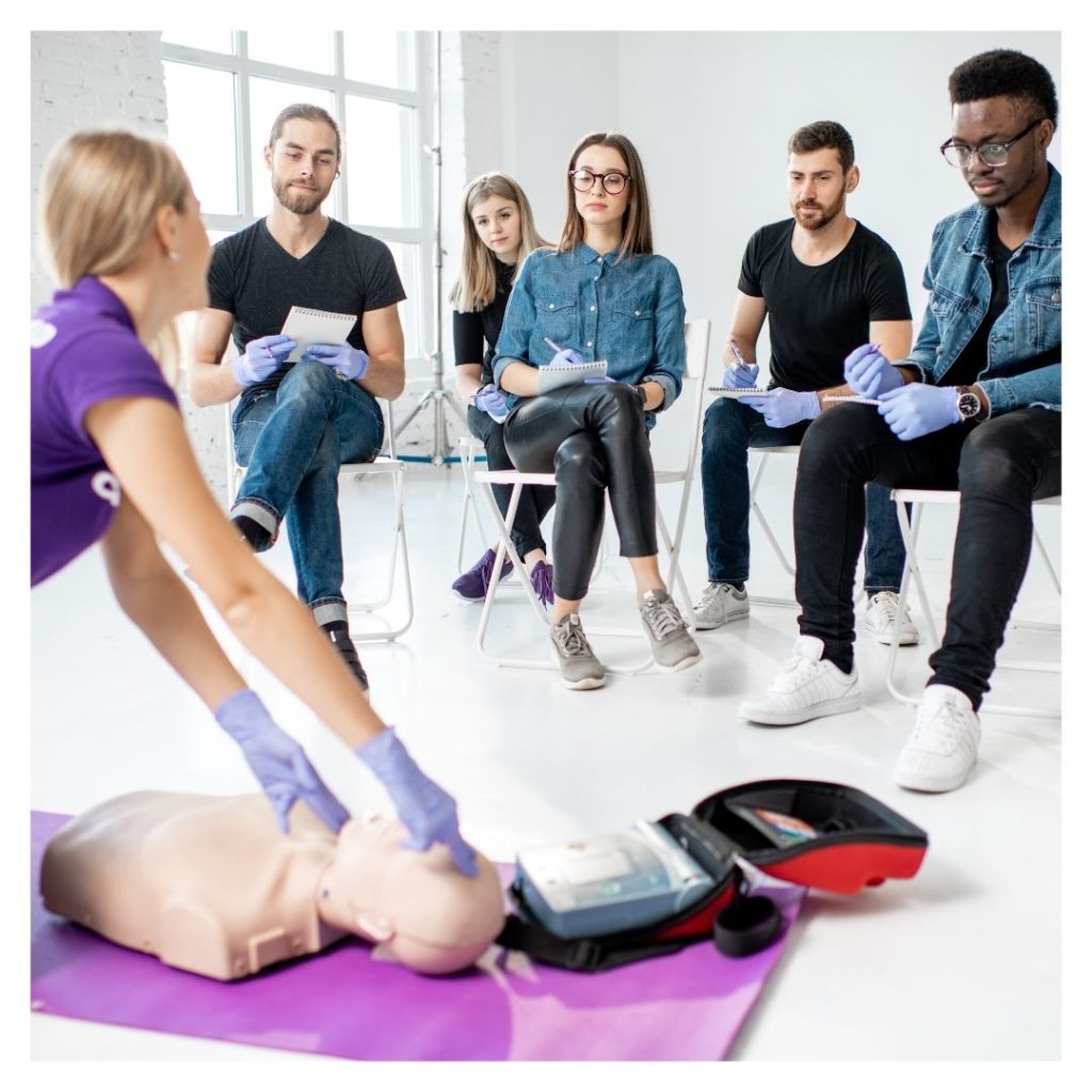 medical professionals watching CPR demonstration