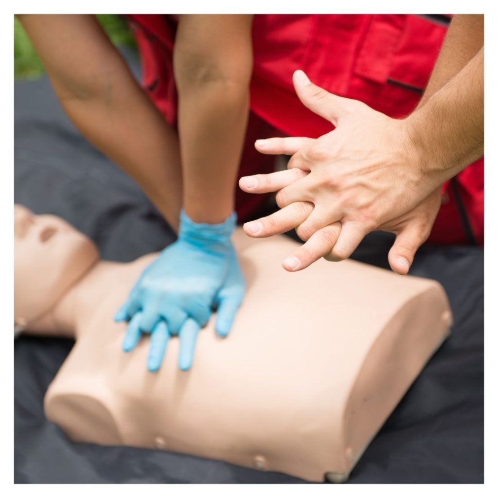 practicing CPR on a dummy