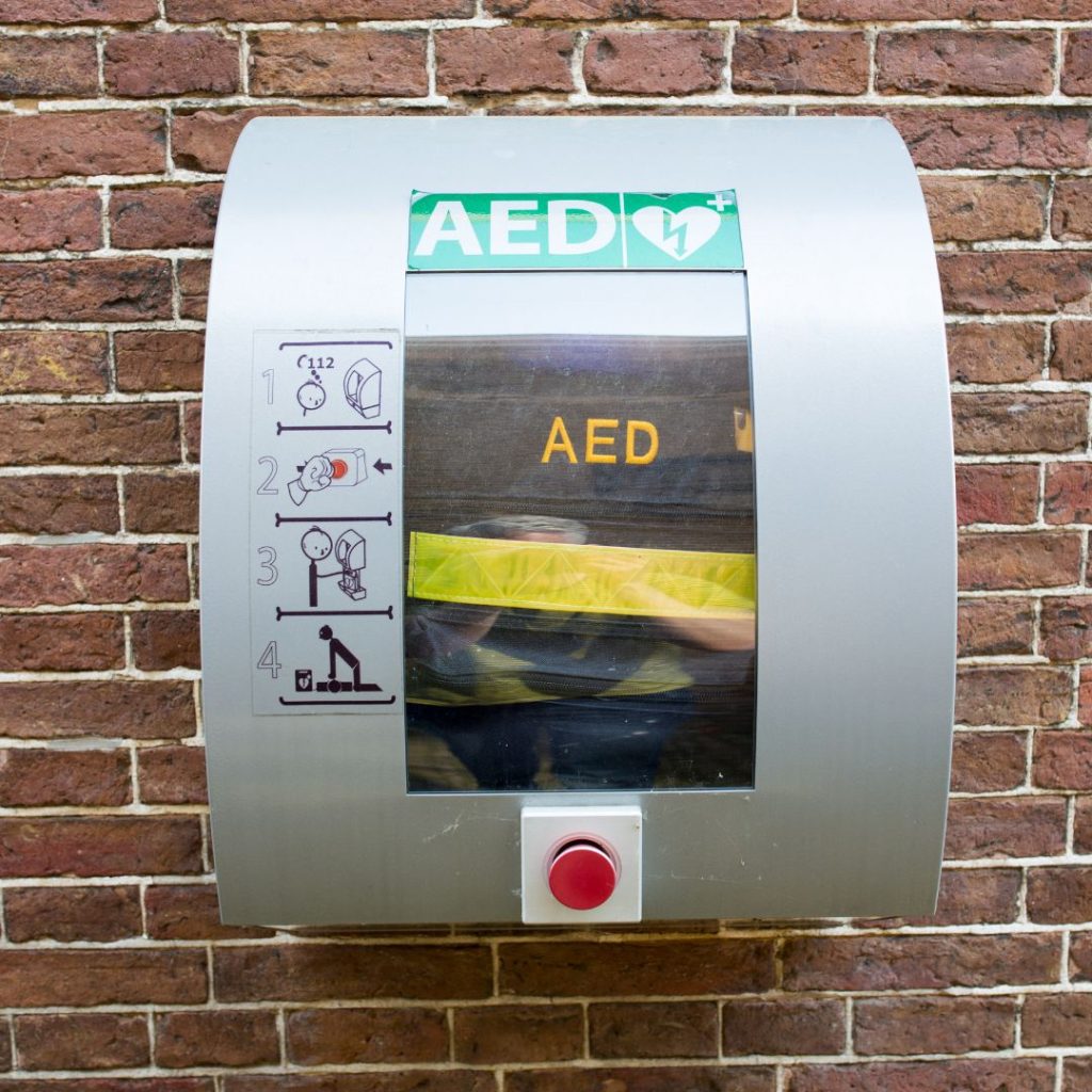 AED on brick wall