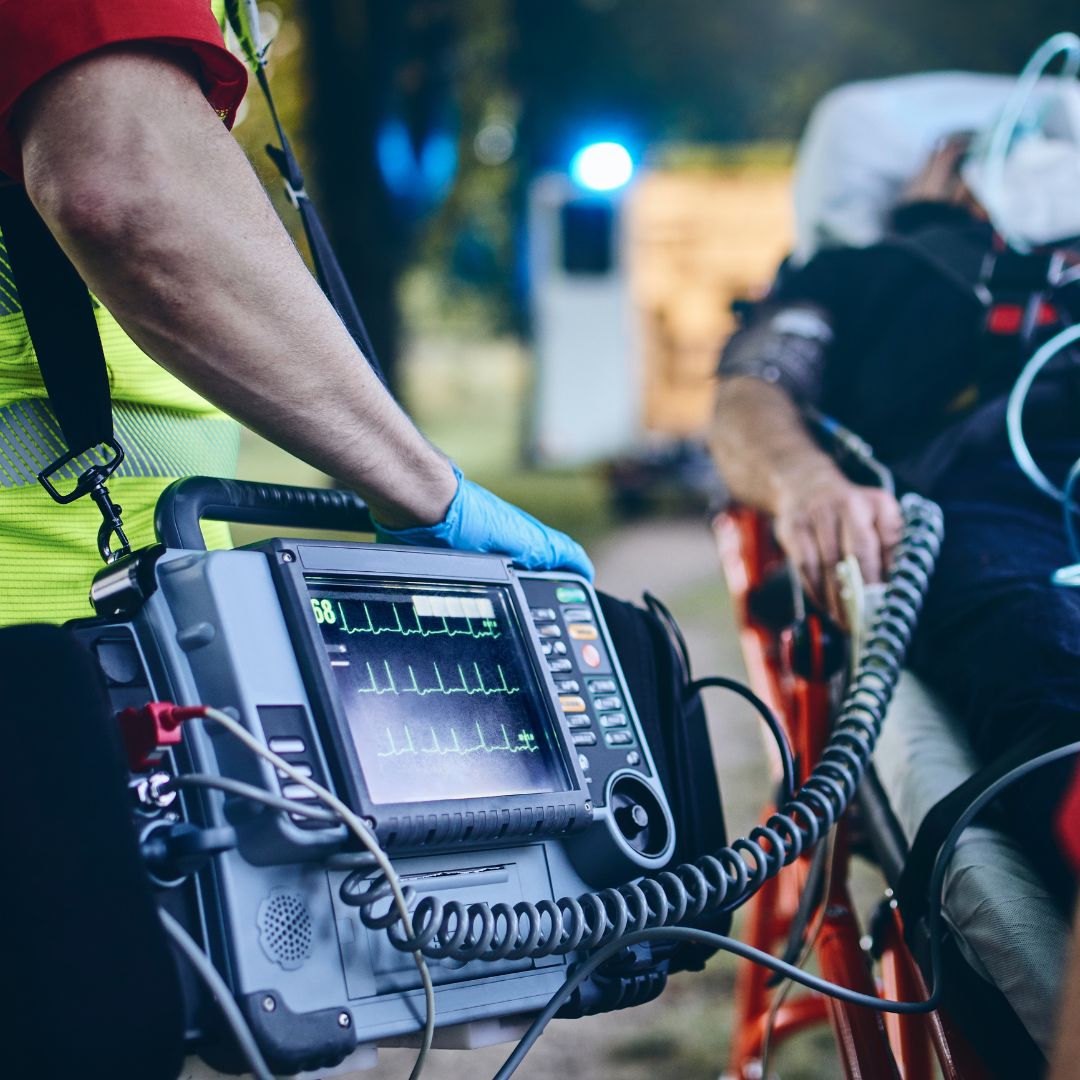 emergency responders standing next to a patient